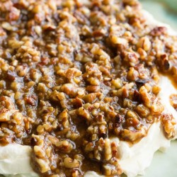 French Quarter Pecan Cheese Spread Recipe Seasoned cream cheese is topped with pecans in a brown sugar and mustard glaze.