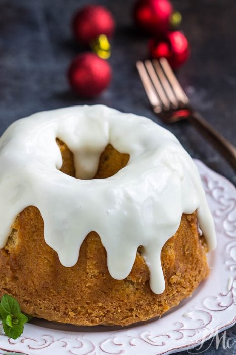 A dessert is highlighted by a cinnamon, cloves, and topped with cream cheese glaze.