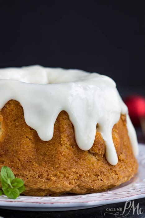 A dessert is highlighted by a cinnamon, cloves, and topped with cream cheese glaze.