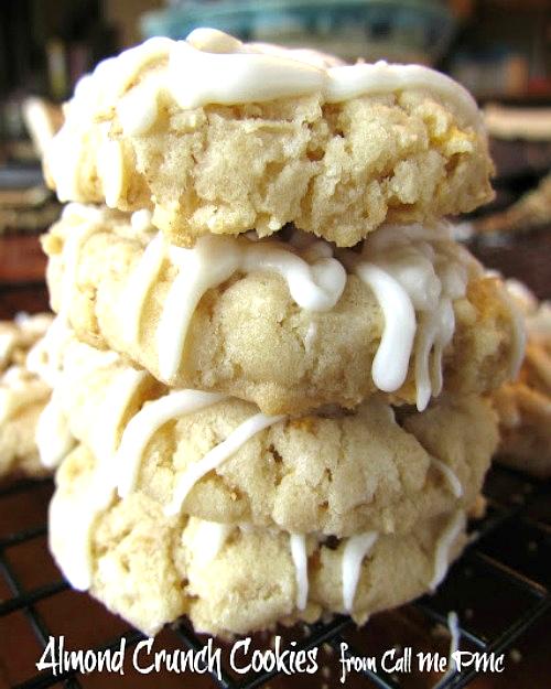 A stack of three irresistible Almond Crunch Cookies drizzled with silky white icing rests gracefully on a wire rack.