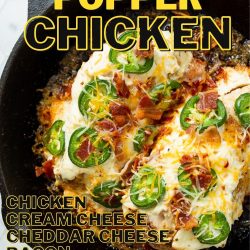 A skillet filled with Jalapeño Popper Chicken, topped with cream cheese, cheddar cheese, jalapeños, bacon, and seasonings. Text on image shows ingredients: chicken, cream cheese, cheddar cheese, bacon, jalapeños, and seasonings.