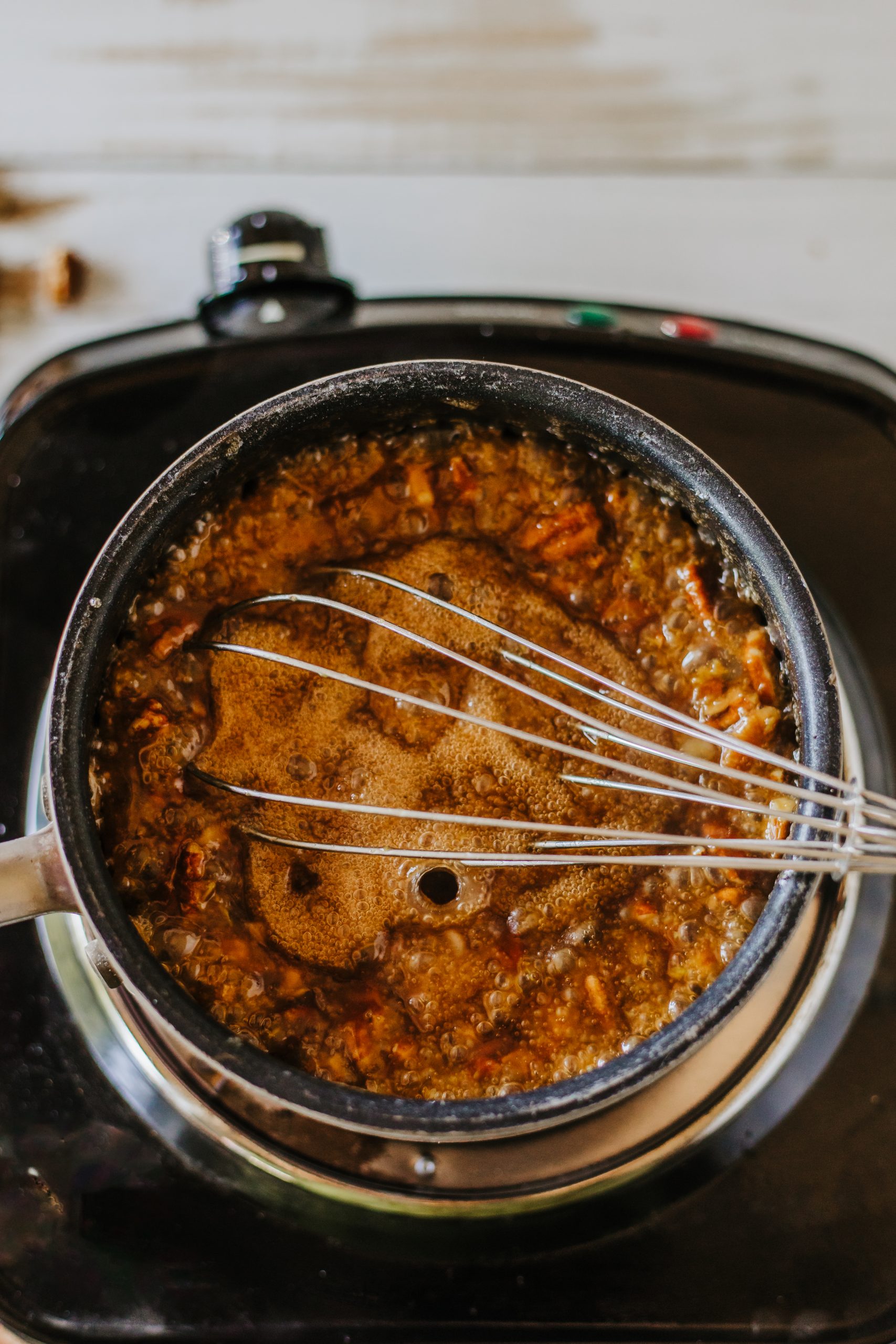 Brown sugar and pecans in a sauce pan.