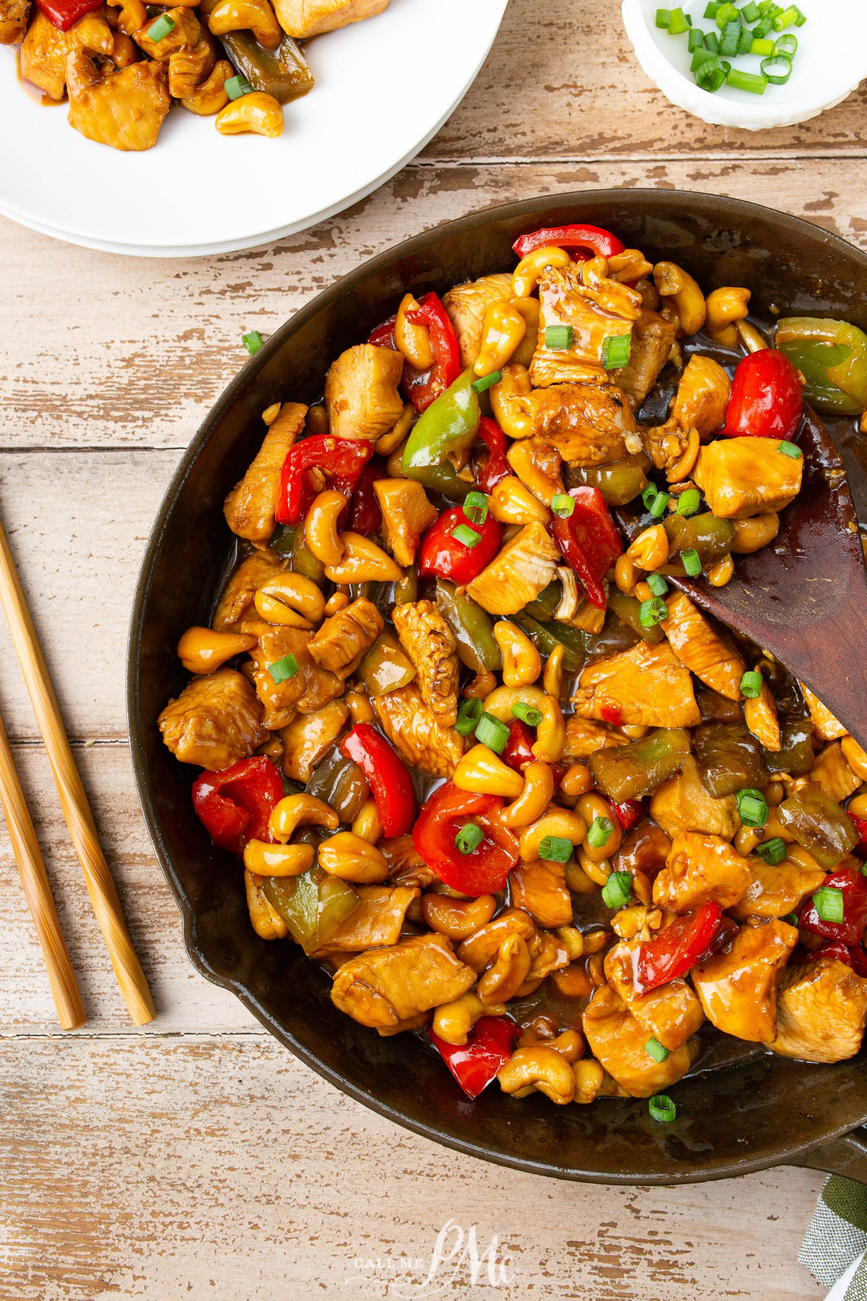 A skillet filled with Asian food. 