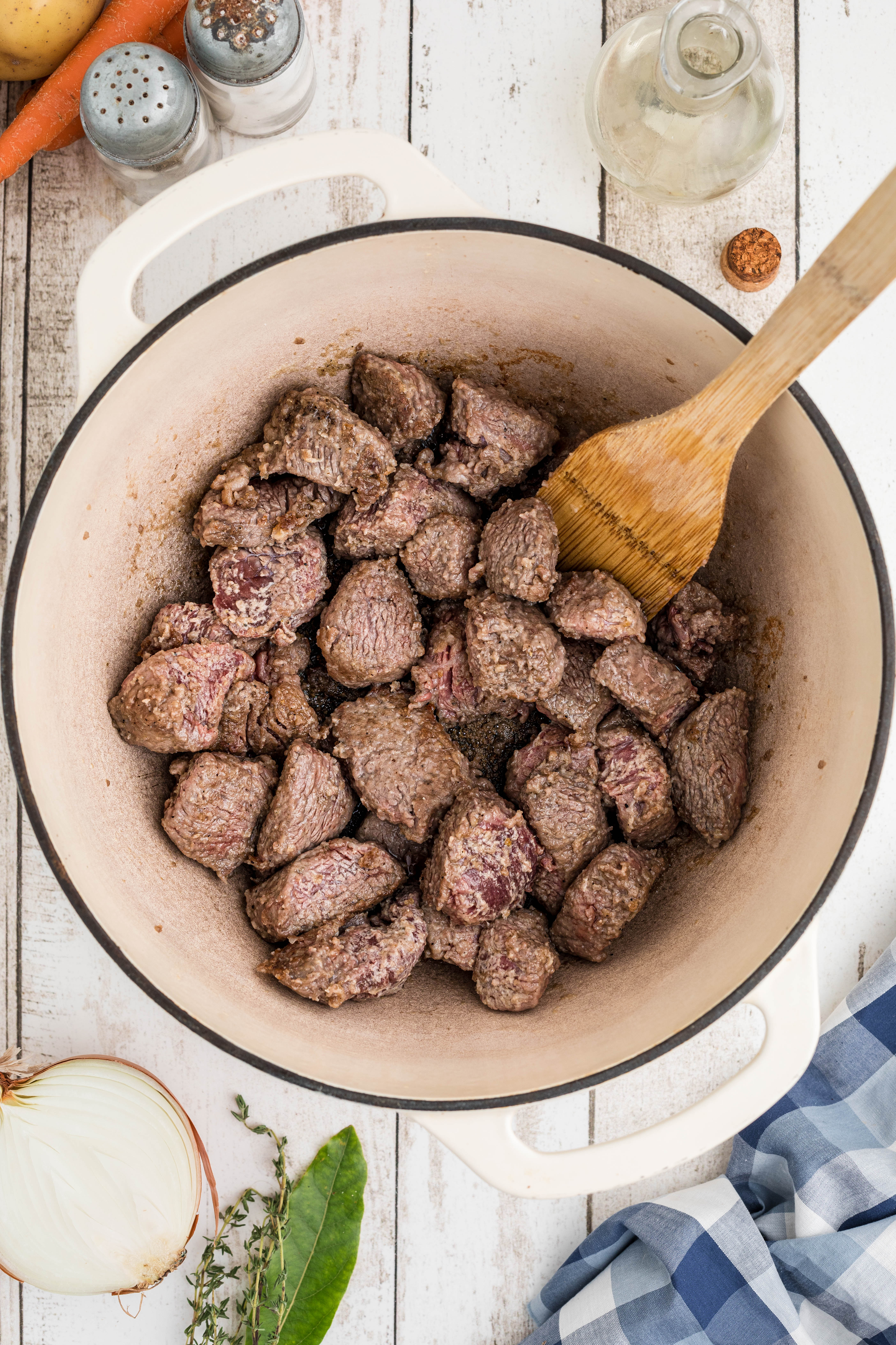 Beef cubes in a pot.