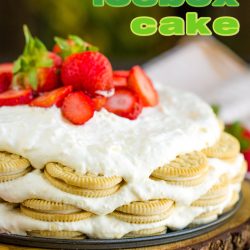 A key lime icebox cake on a wooden serving board, topped with cream and sliced strawberries. Large, colorful letters above the delicious dessert spell out "key lime icebox cake.