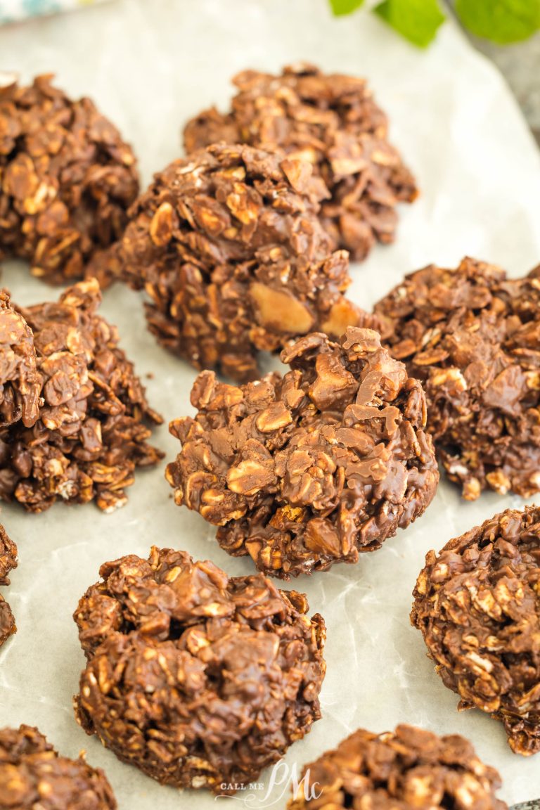 Chocolate oatmeal cookies on parchment paper, clustered together, showcasing a textured surface with visible oats and cocoa.