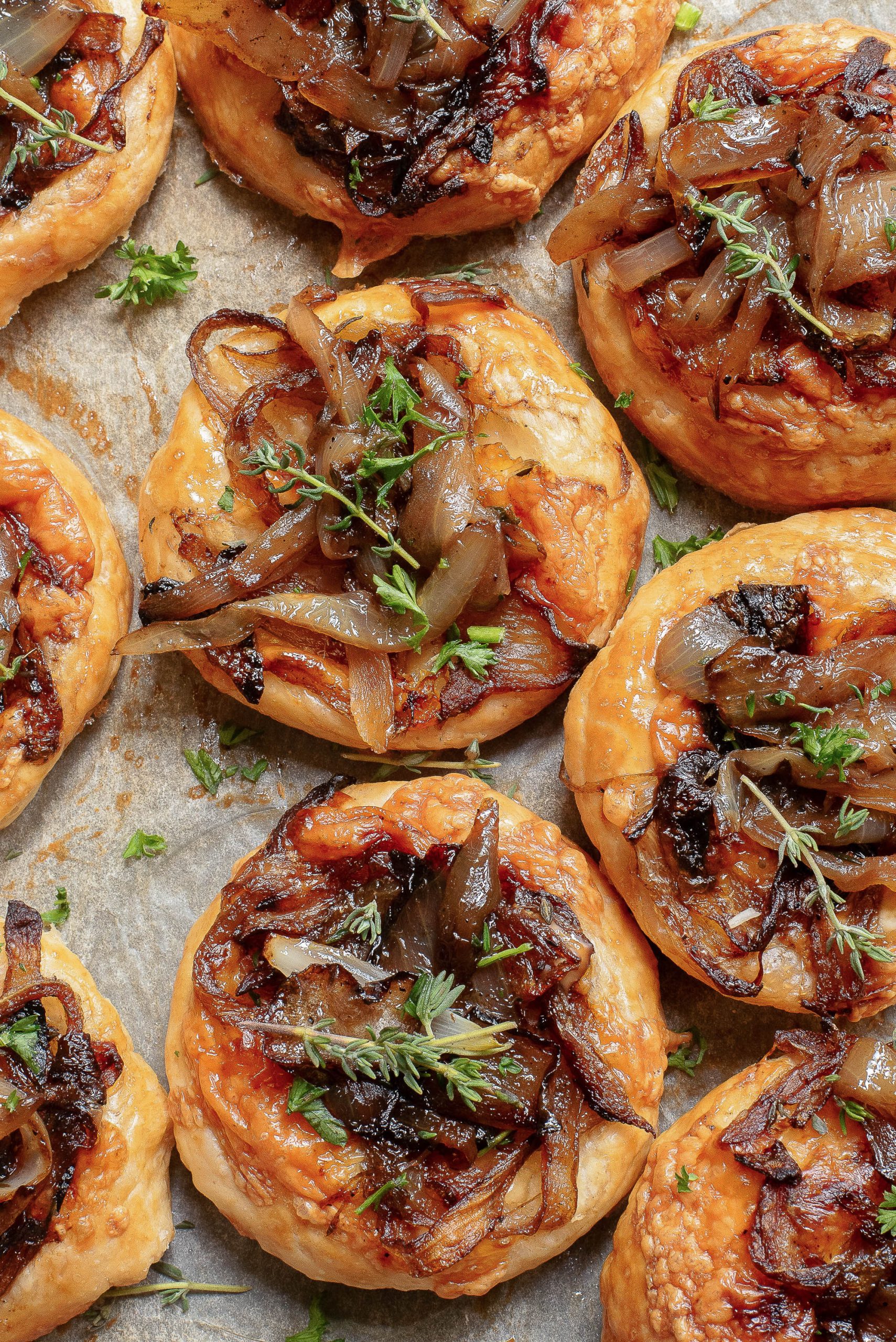 Savory pastries arranged on parchment paper.