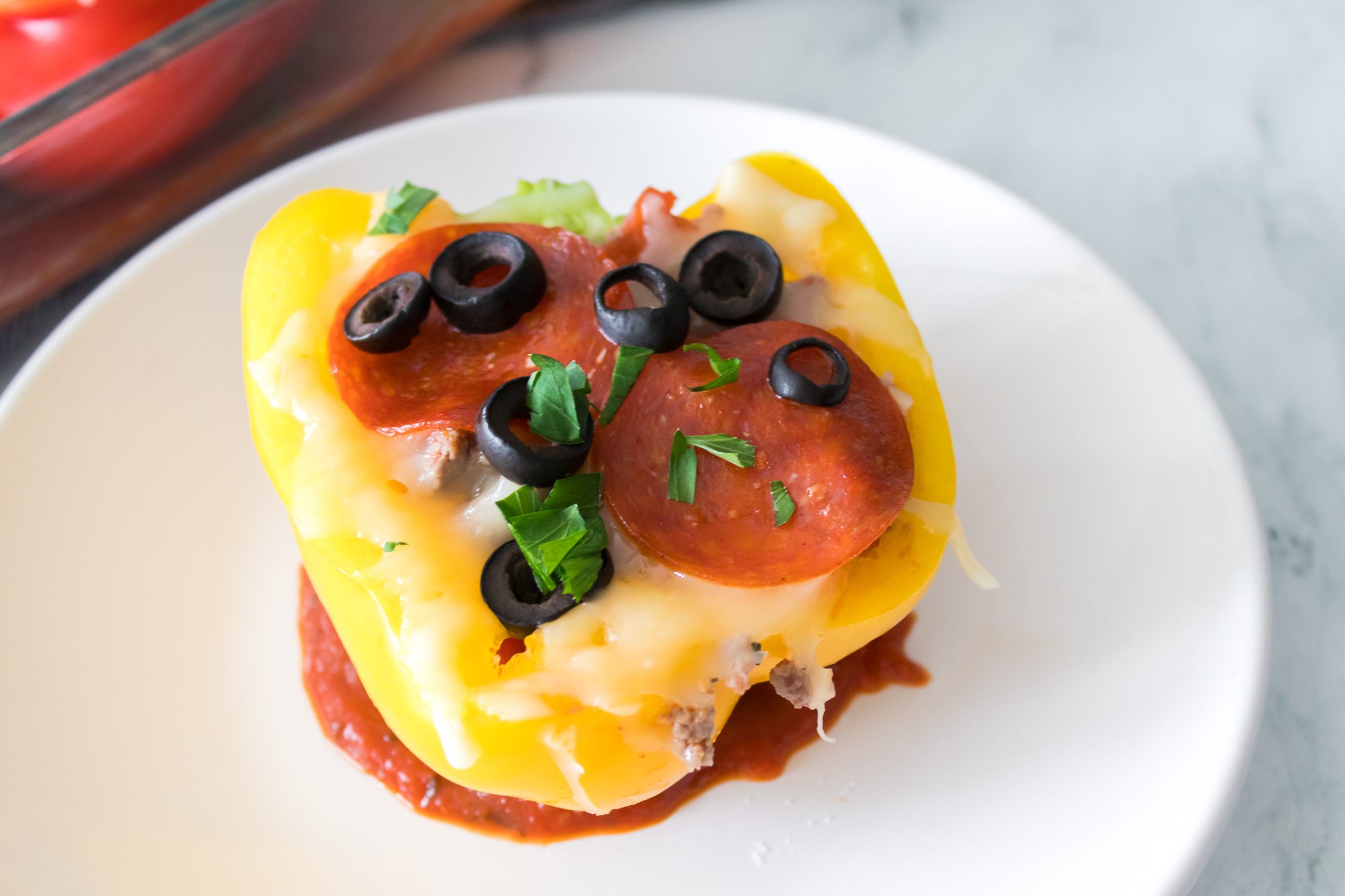 Stuffed vegetable on a white plate.