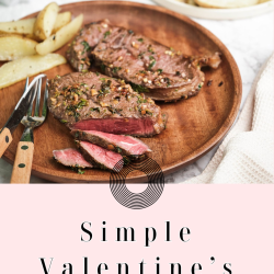 Sliced steak with herbs on a wooden plate, served with potato wedges. Text reads "Simple Valentine’s Day Meals for a Romantic Dinner.